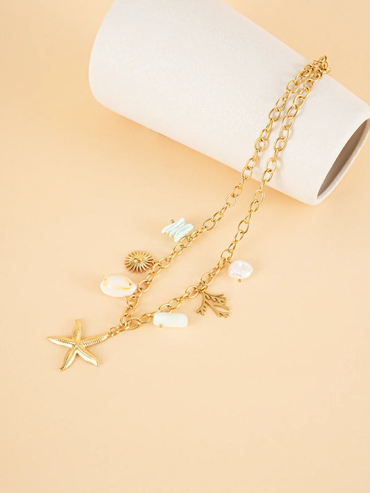 Collier chaîne dorée breloques de la mer blanc